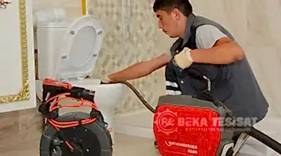 robotla cihazla tuvalet acma